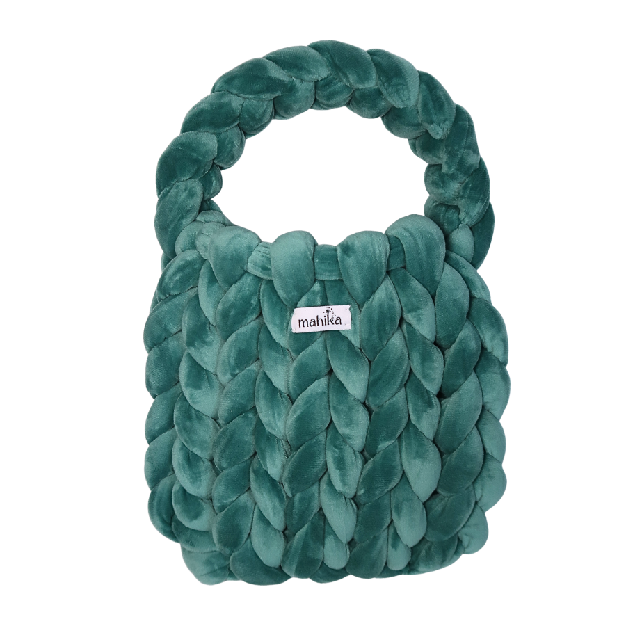 teal Green braided plush hand bag that was finger knitted with 'mahika' label on a white background
