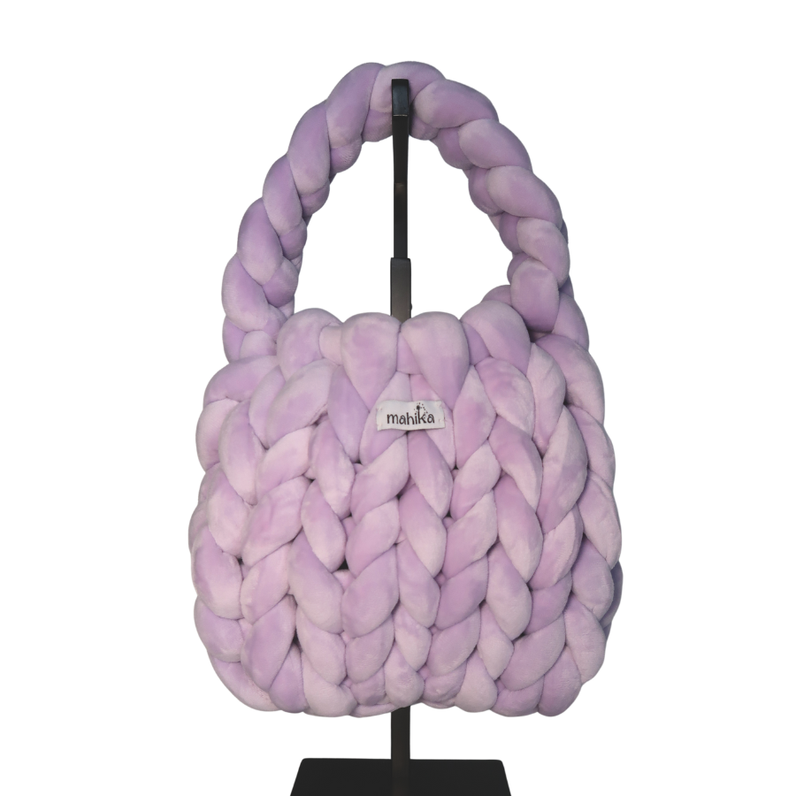 Purple braided and finger knitted bag on a stand with 'mahika' branding on a white background